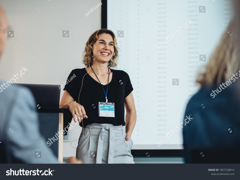 Stock Photo Smiling Businesswoman Delivering A Speech During A Conference Successful Business Professional 1857228814